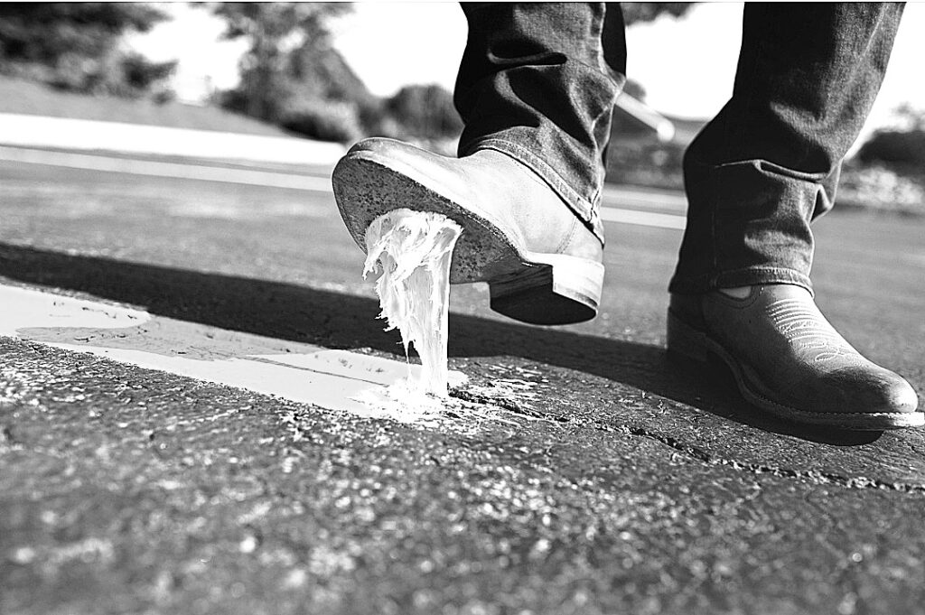 a person stepping on a puddle of water